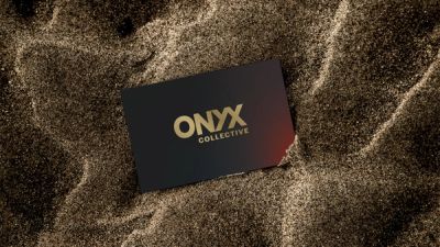 Onyx Collective business card in gold sand