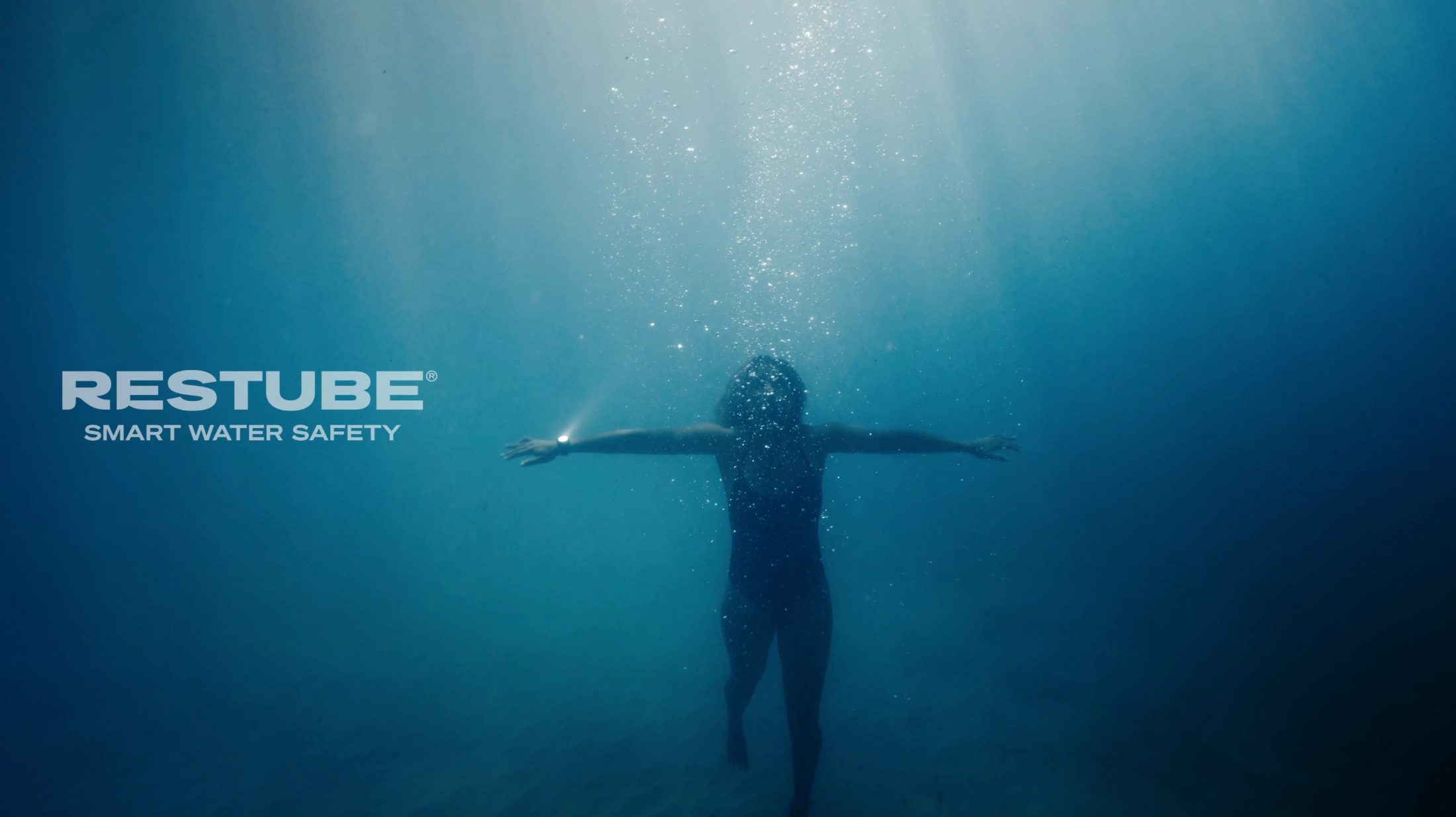 a young women in the blue sea 