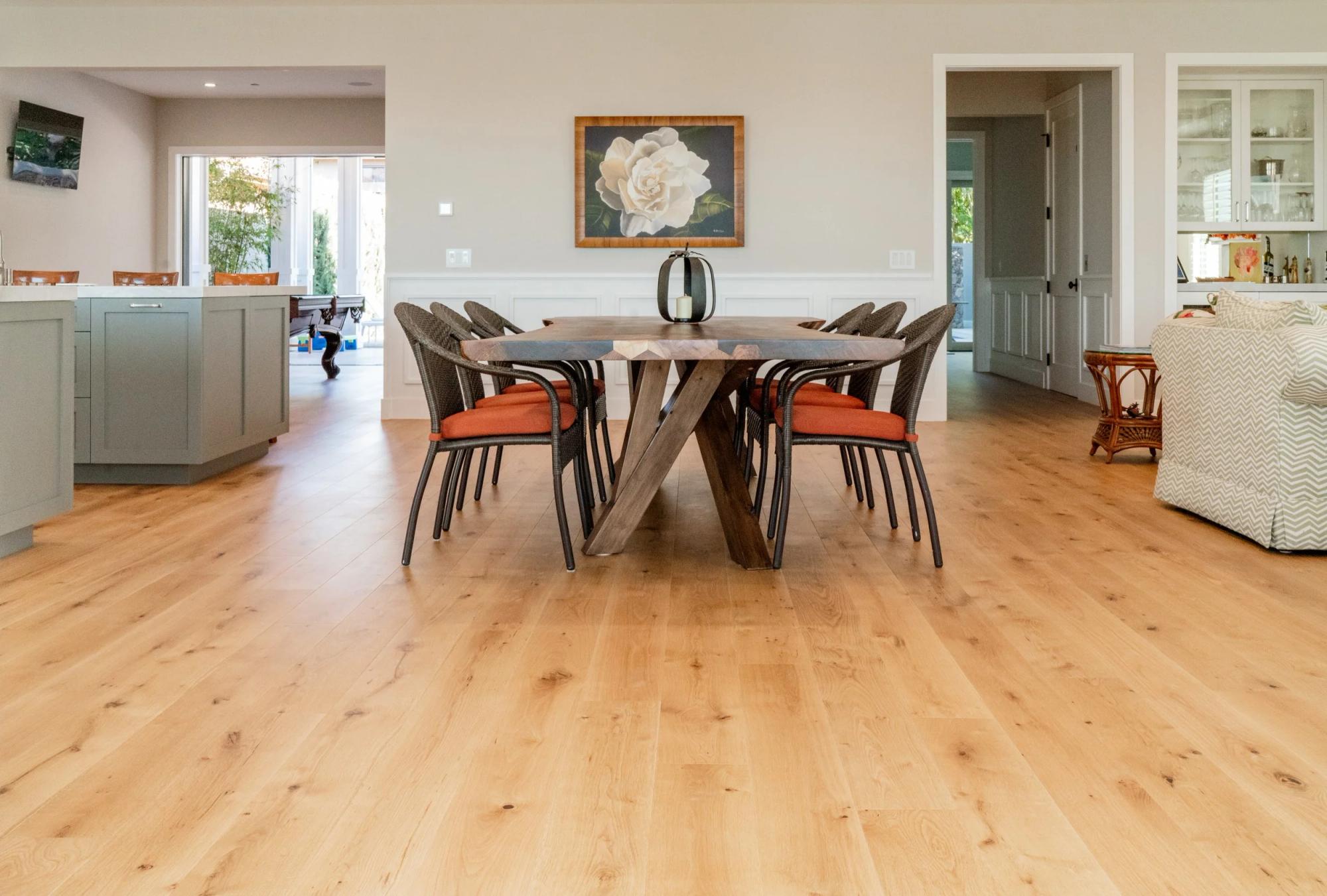 Wide-plank engineered hardwood dining room showing floor expanse in custom home