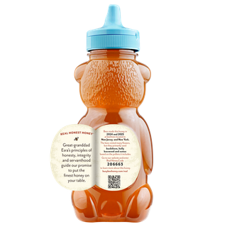 Back of 12 oz Northeast Busy Bee Raw Honey bear bottle with label peeled away to share this honey's story