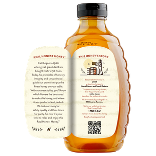 Back of 32 oz Dakota Clover Busy Bee Raw Honey bottle with label peeled away to show this honey's story