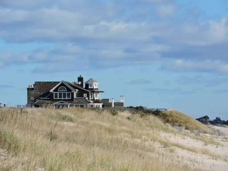 Shingled beach house behind dune grass, Bridgehampton, The Hamptons