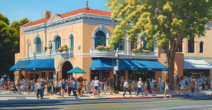 A busy street in Pasadena featuring the historic Pasadena Playhouse with colorful flowers and trees, and diverse people walking by.