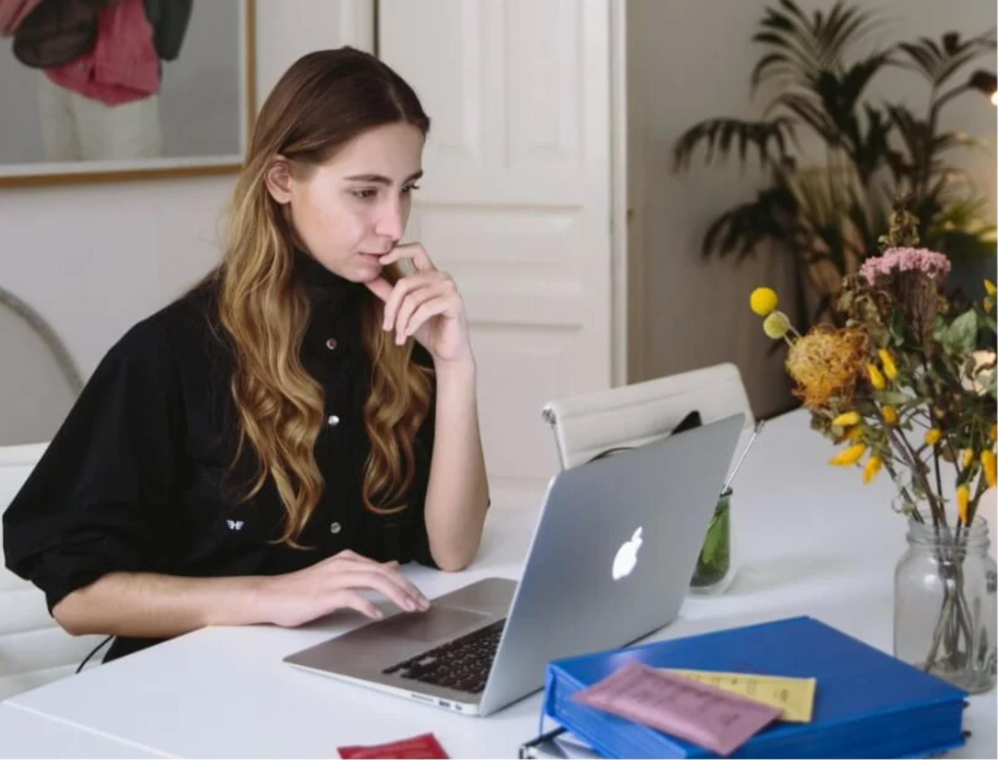 Person using laptop at table
