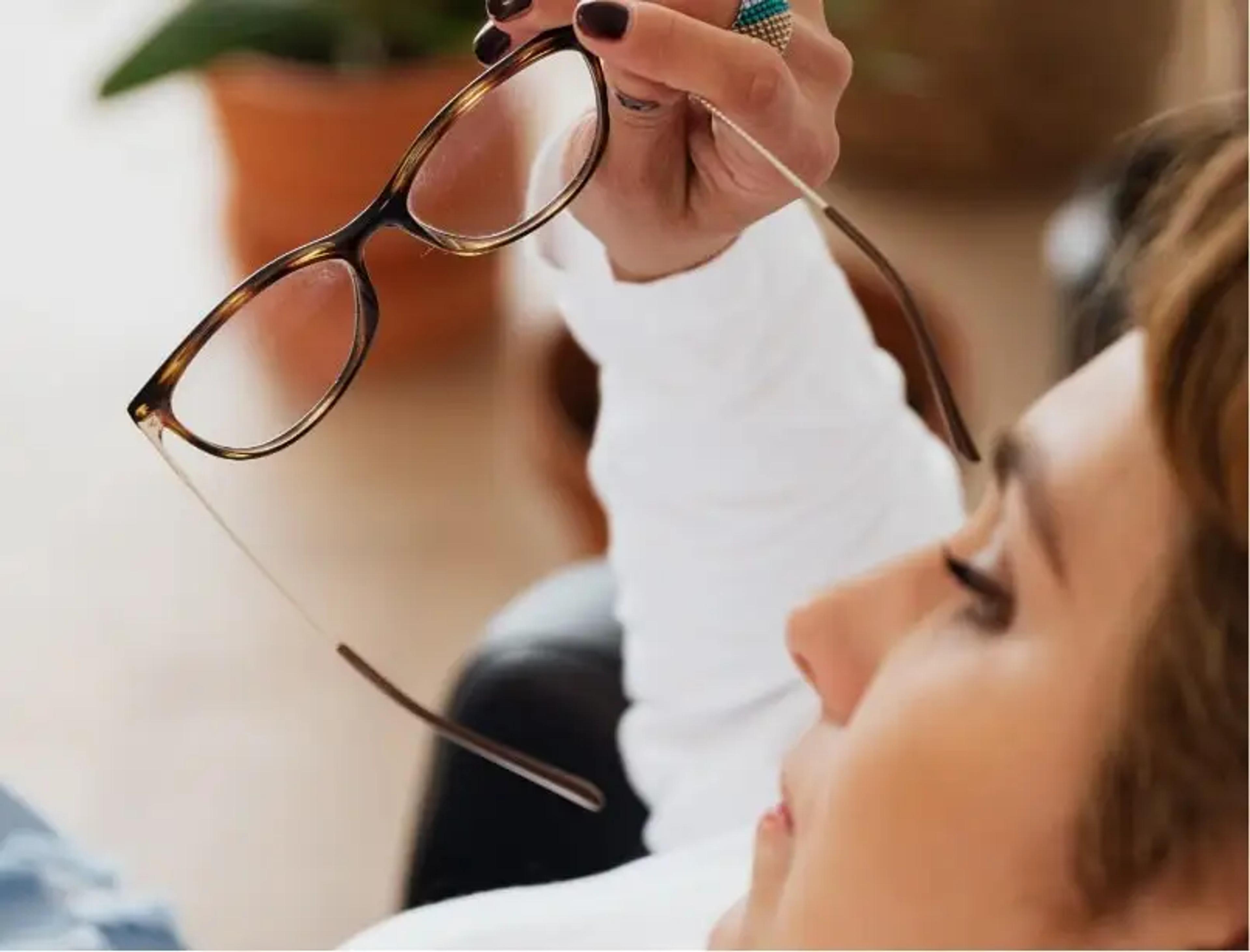Person holding glasses