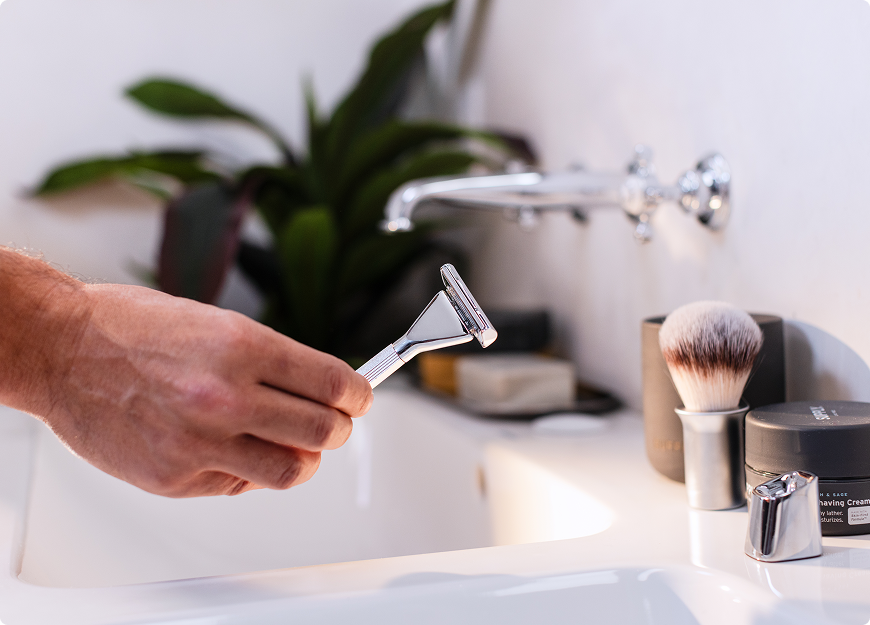 razor in bathroom by makeup brush