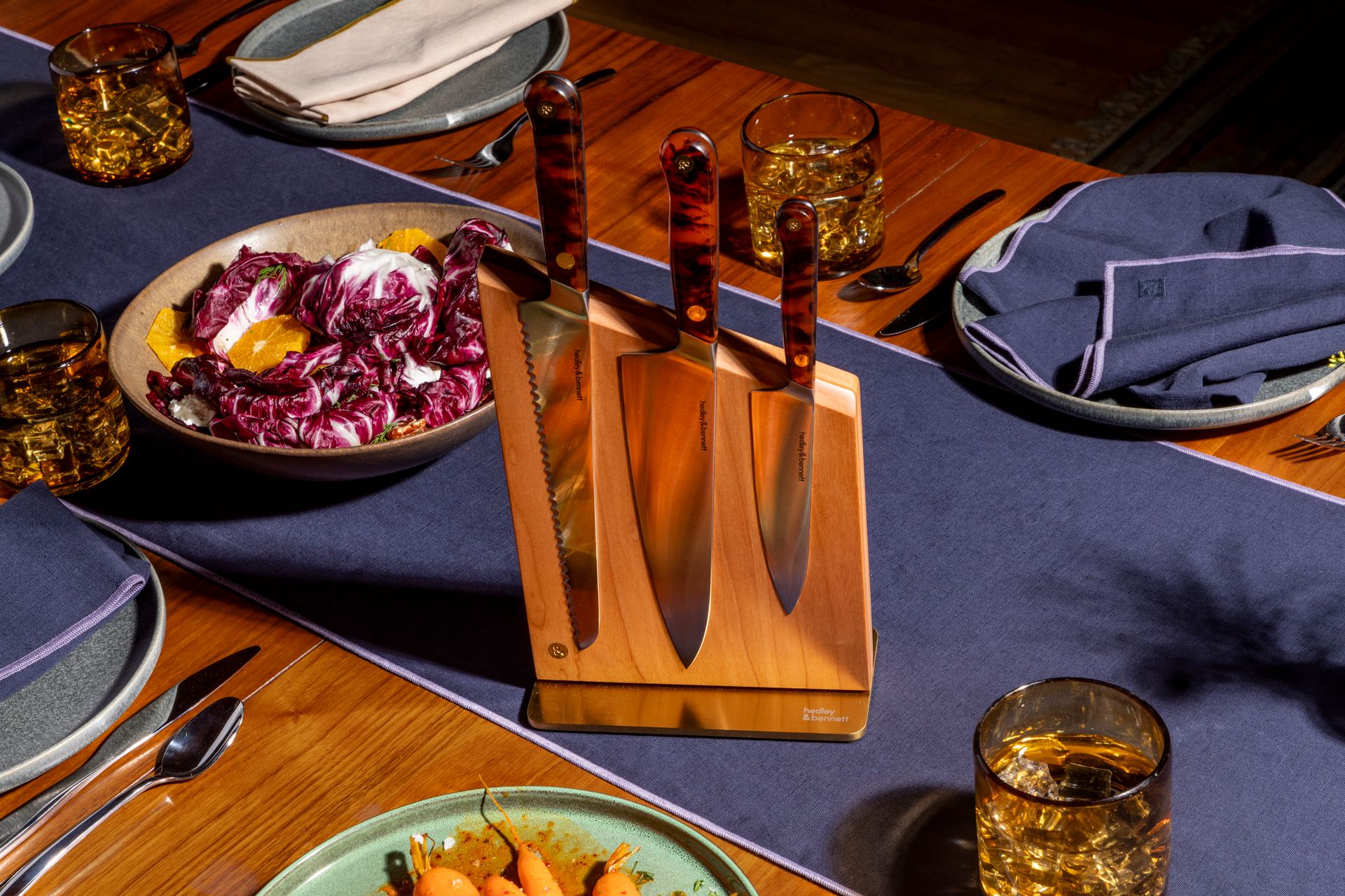 knives in wooden knife holder on set dining table