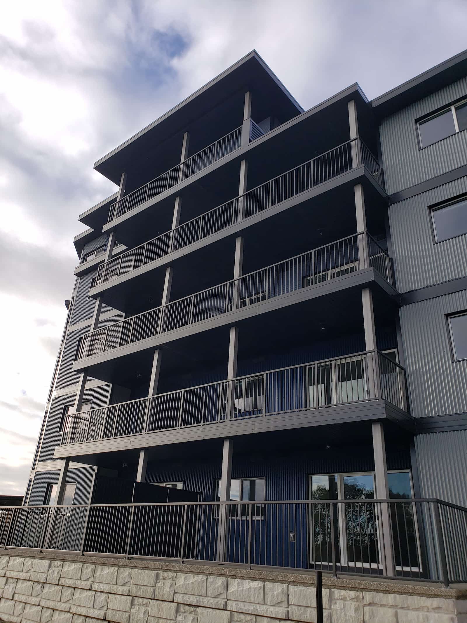 Aluminum picket balcony railing on a multi-story commercial building in Gibsons BC on the Sunshine Coast