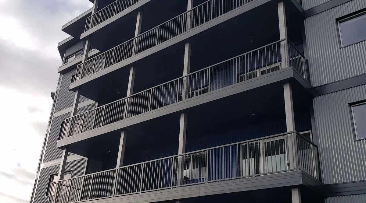 Aluminum picket balcony railing on a multi-story commercial building in Gibsons BC on the Sunshine Coast