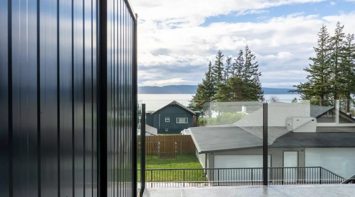 Frameless glass deck railing system showing clear unobstructed views on residential deck installation