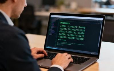 Developer working on GTP login authentication setup on laptop screen