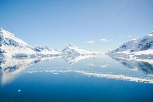 Yacht sailing on calm sea.