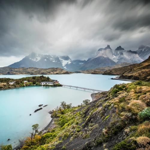 Elegant yacht cruising peacefully on open blue waters.