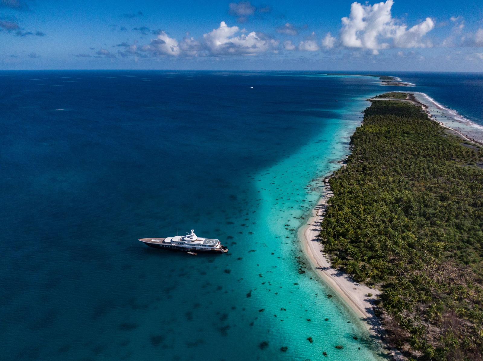 Elegant interior lounge of a luxury yacht with plush seating and soft lighting