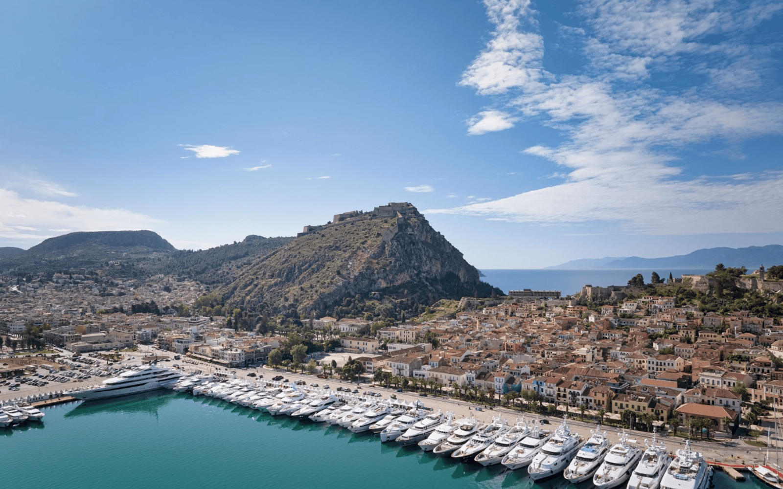 Sleek luxury yacht cruising through deep blue ocean waters.