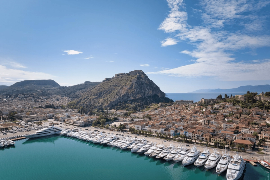 Sleek luxury yacht cruising through deep blue ocean waters.