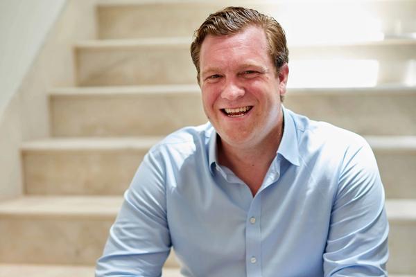 Crew member on yacht deck in uniform