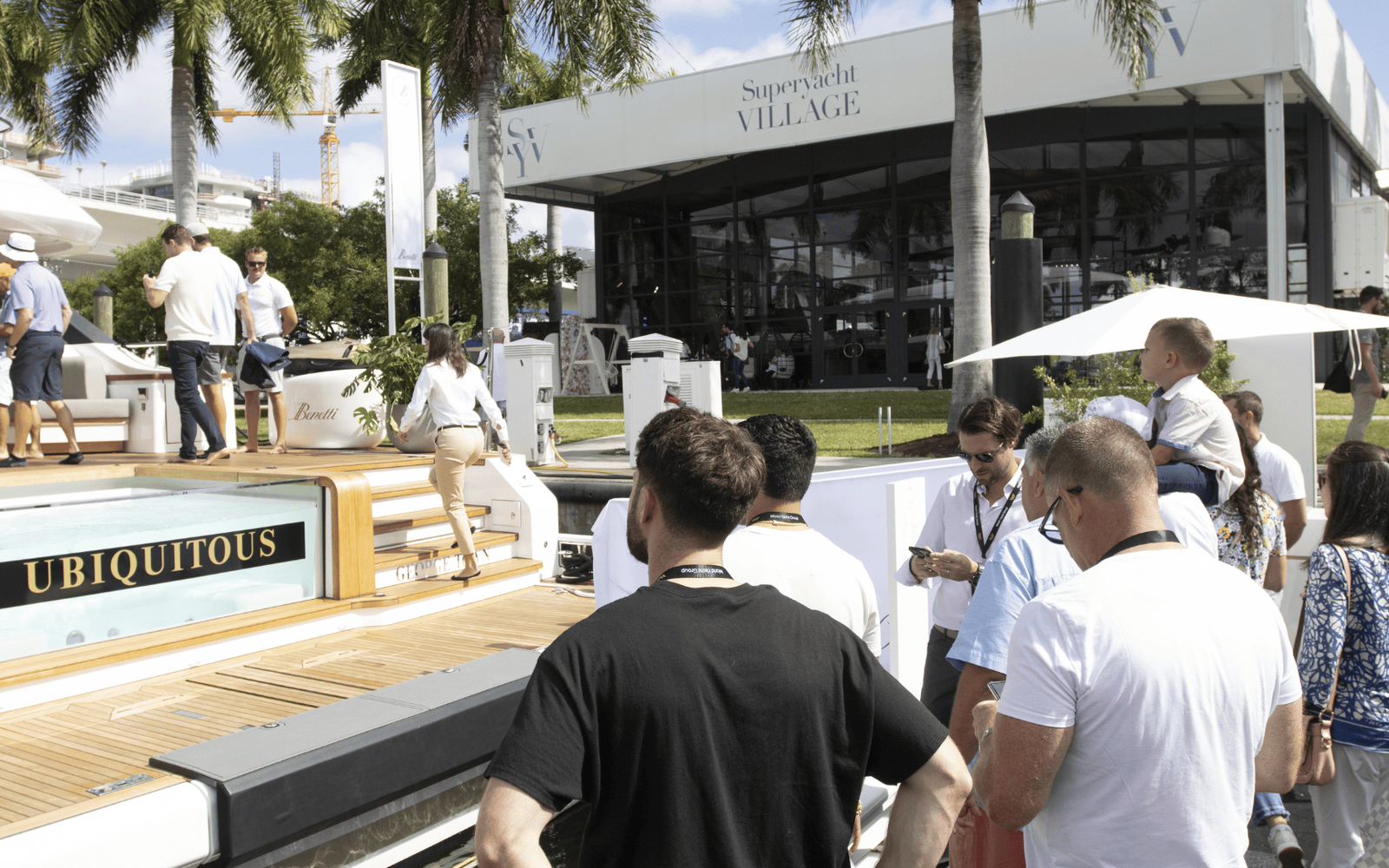 Modern yacht cruising on calm blue sea under a clear sky.