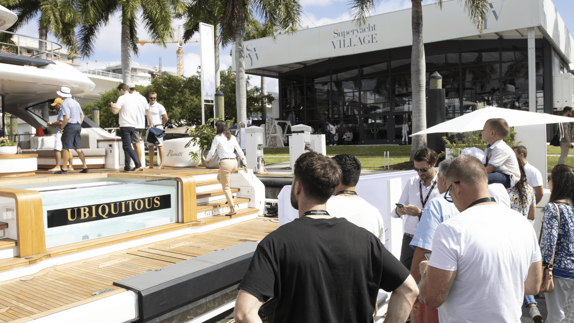 Modern yacht cruising on calm blue sea under a clear sky.