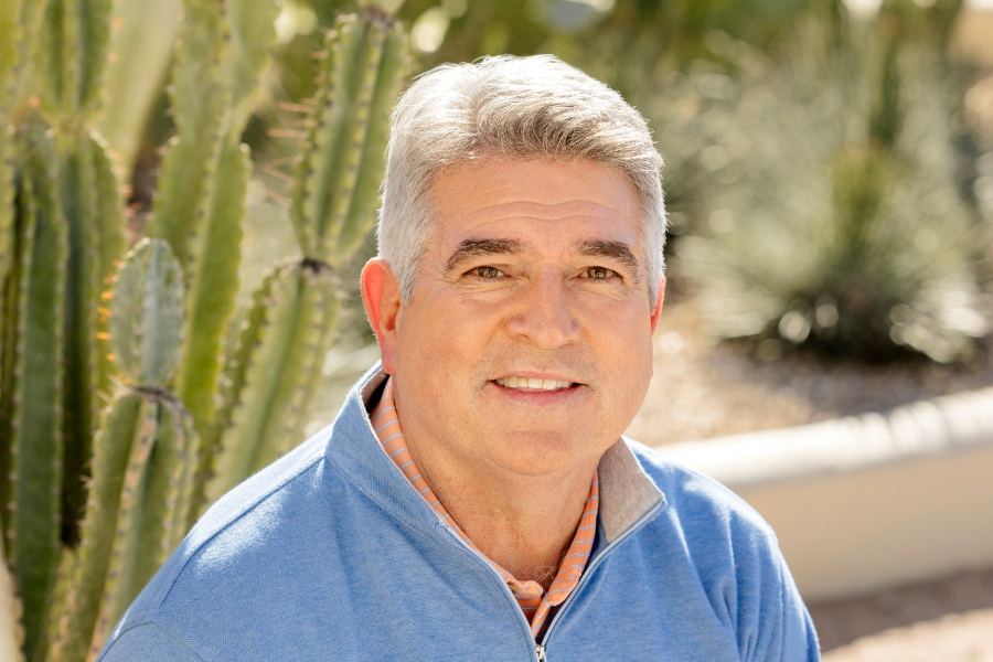 Joe Sanchez smiling for Consumer Cellular.