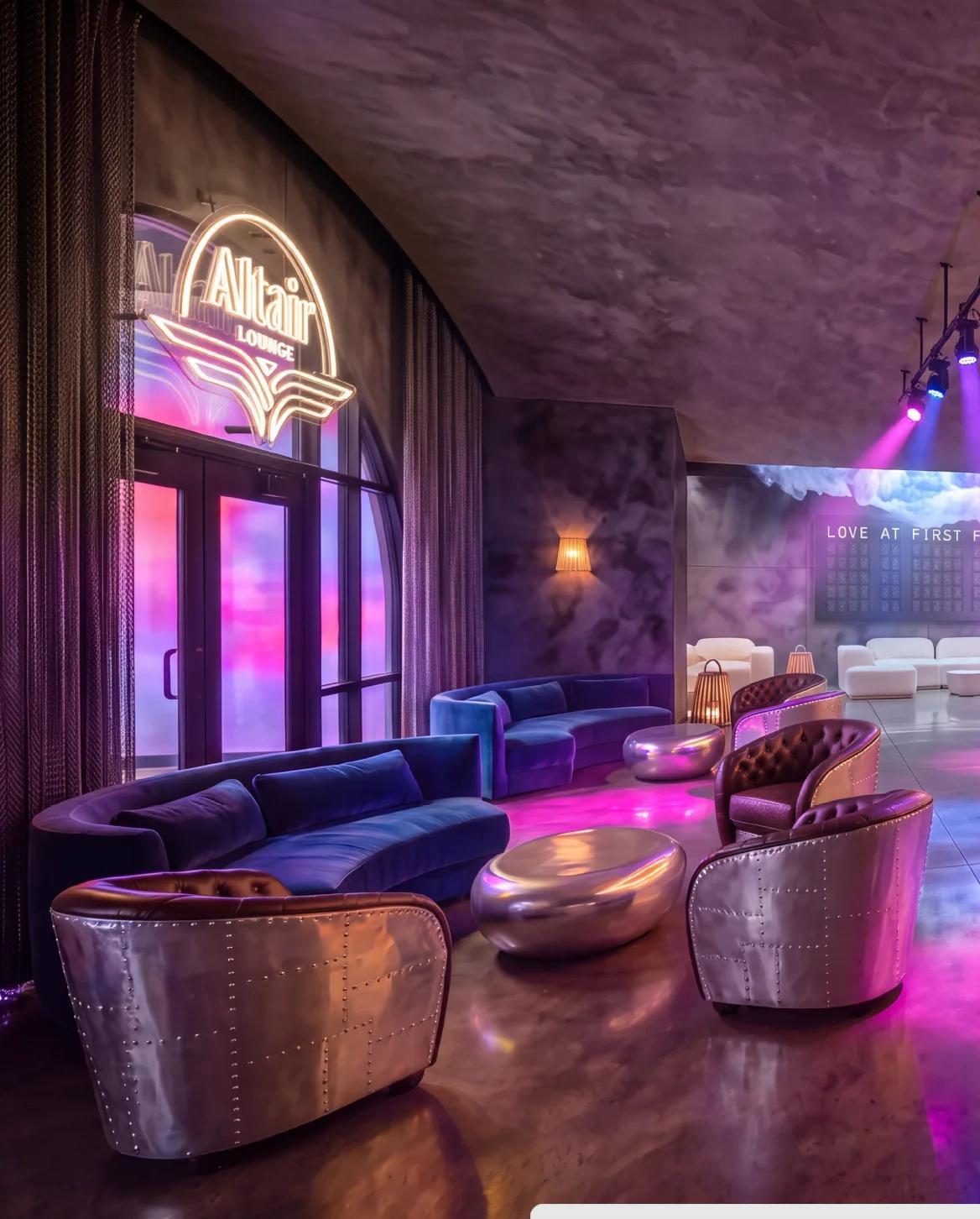 Lounge seating under neon signage