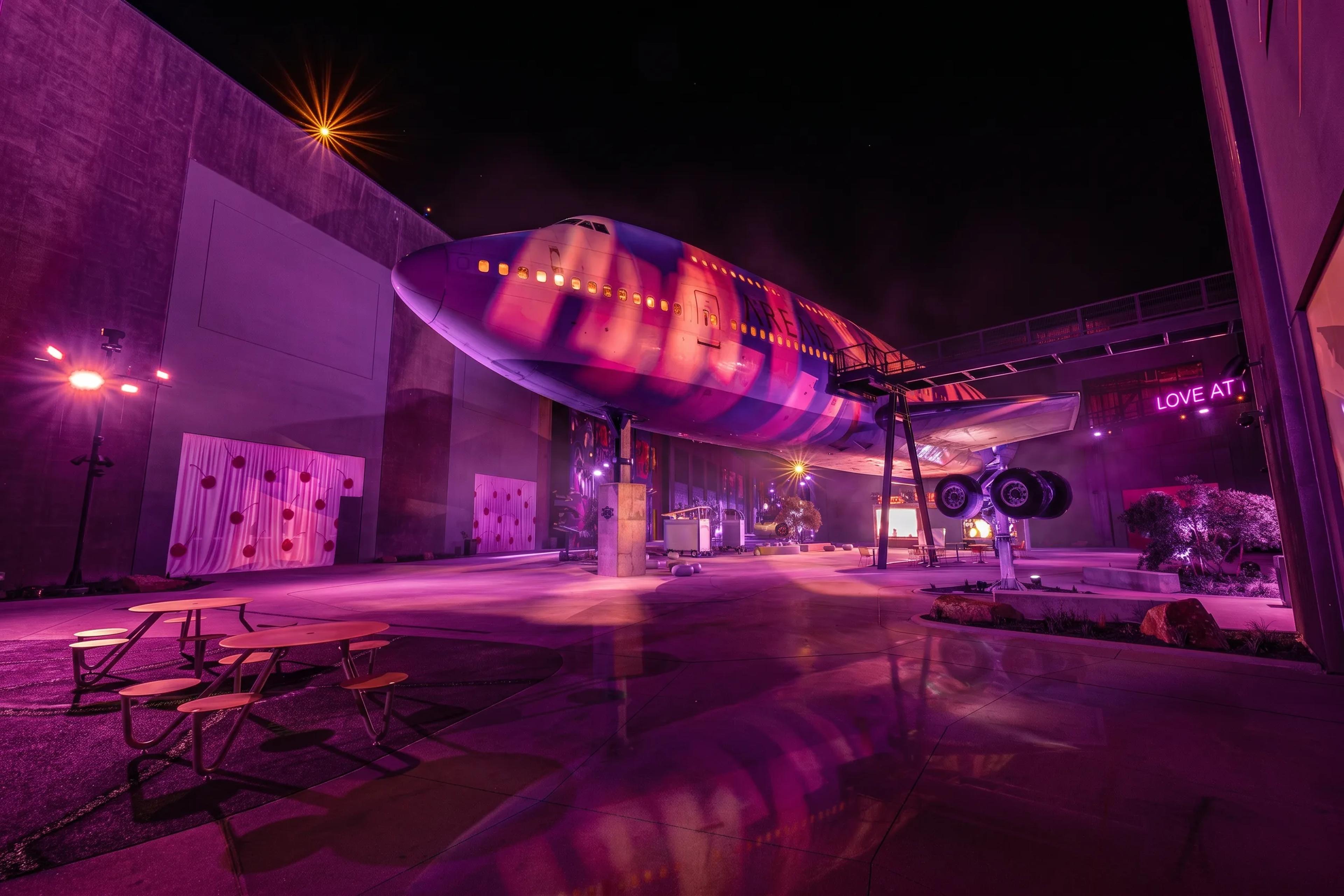 The aircraft exterior lit in violet