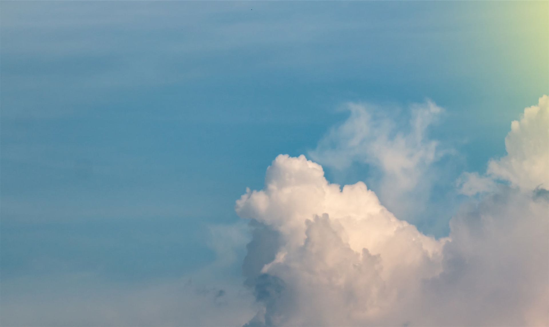 Clouds with sunlight in the top right corner