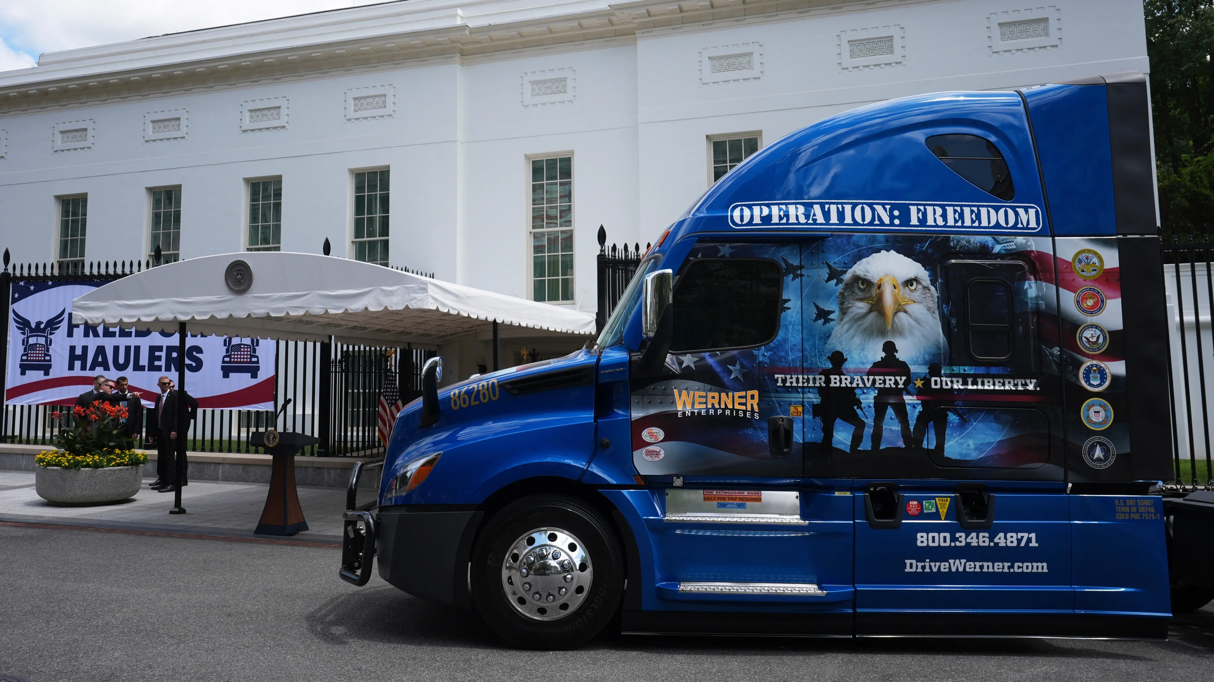 A truck is place in front of the White House for a press conference.
