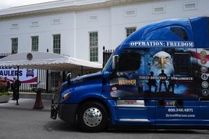 A truck is place in front of the White House for a press conference.