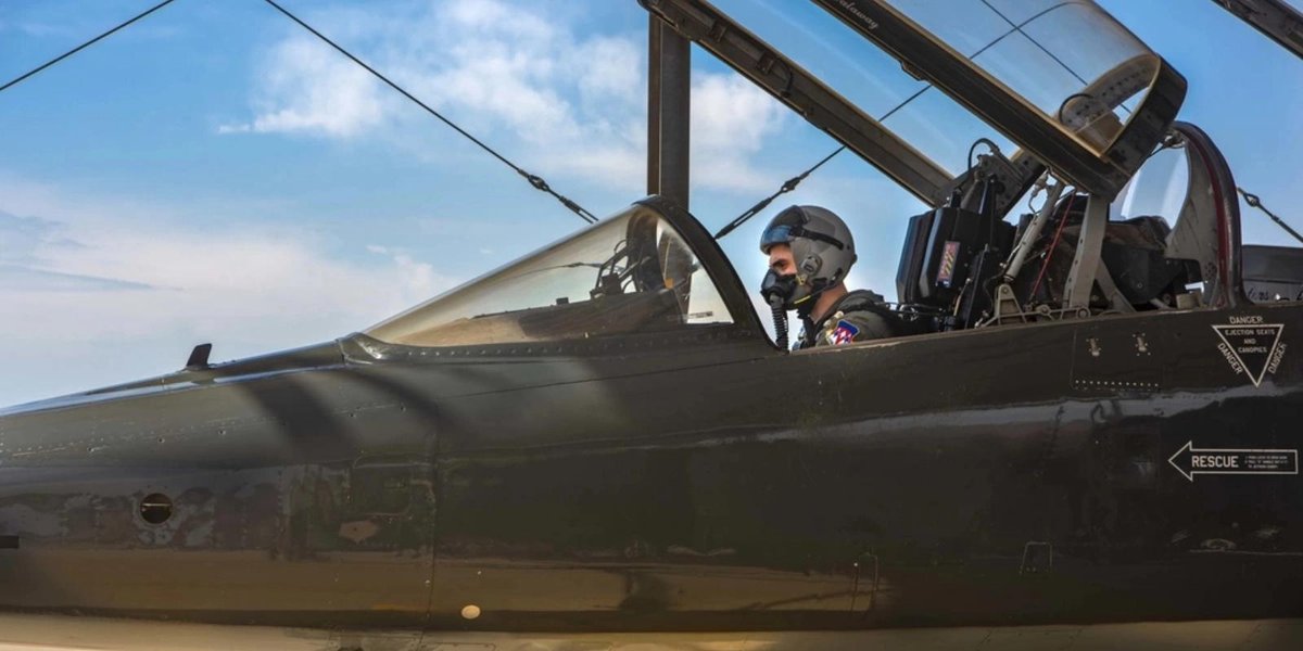 USAF pilot in T-38 Talon cockpit preparing for training flight