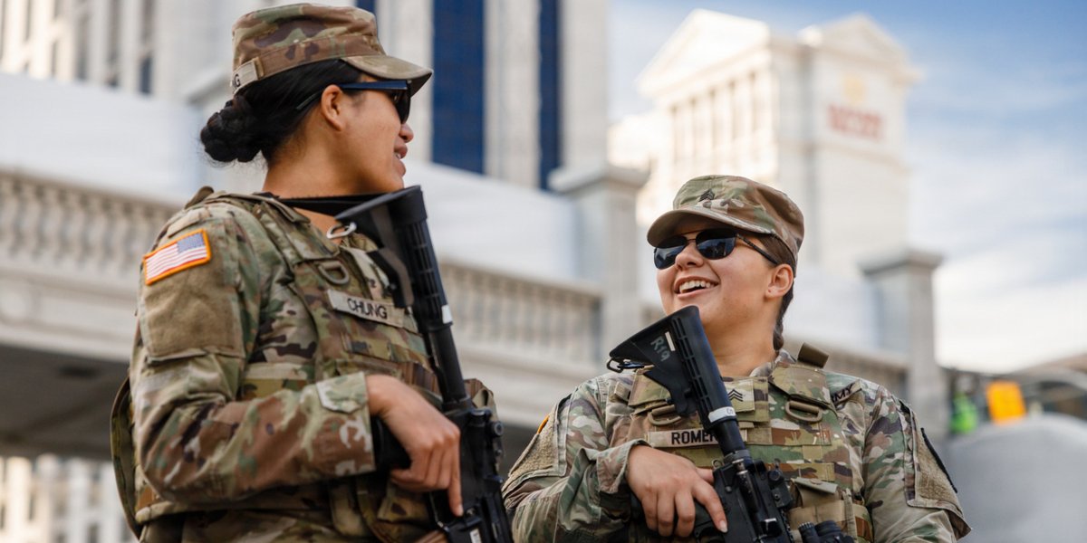 U.S. Army Sgt. Haylee Romero (right) and Spc. Leiana Chung, 422nd Expeditionary Signal Battalion - Expeditionary, B. Company, perform security operations at the Formula 1 Las Vegas Grand Prix in Las Vegas, Nevada, Nov. 20, 2025.