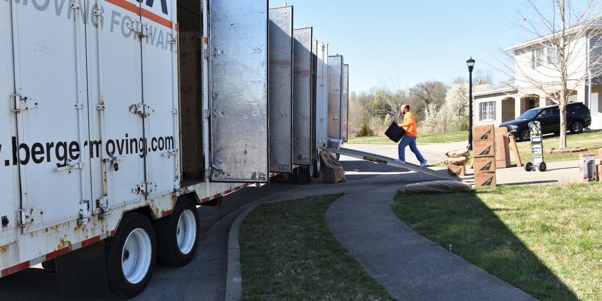 Packers and mover loading up a moving truck for a military family PCSing.