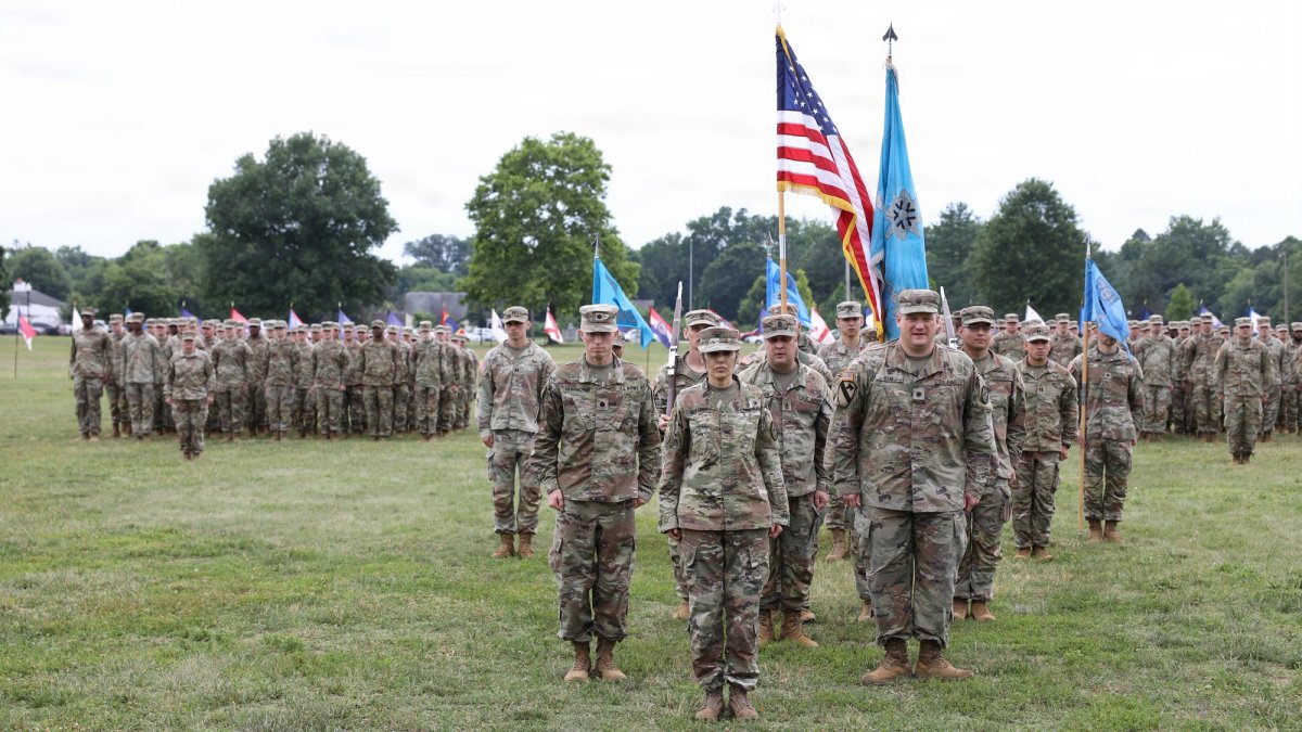 A platoon of soldiers stand in formation.