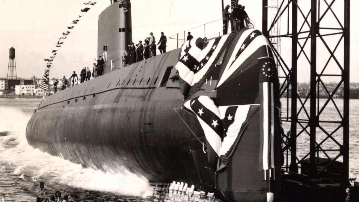 Vintage photo of submarine USS Nautilus dropping into the Thames River.