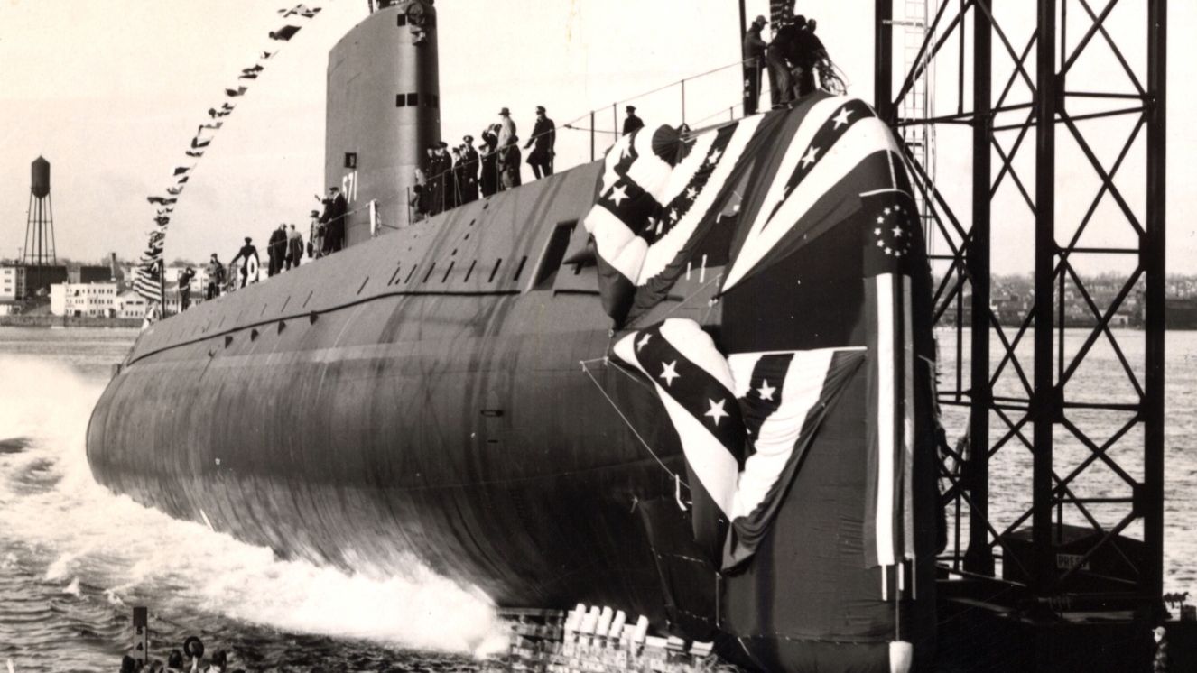 Vintage photo of submarine USS Nautilus dropping into the Thames River.