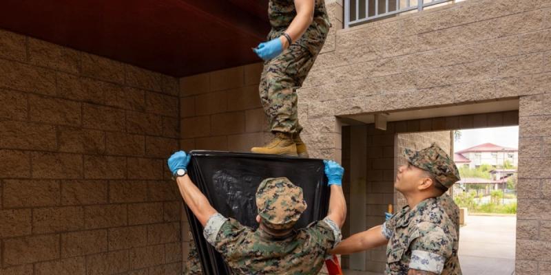 U.S. Marines assigned to Headquarters and Service Battalion, 1st Marine Logistics Group, clean out roof gutters during Operation Clean Sweep IV on Marine Corps Base Camp Pendleton, California, April 1, 2026.
