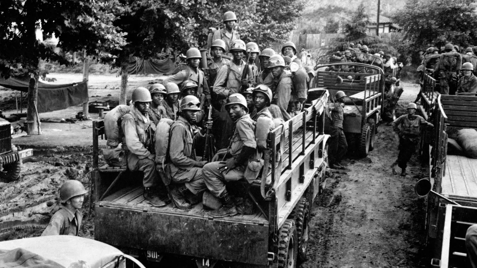 Vintage photo of Black soldiers in a truck in Korea.