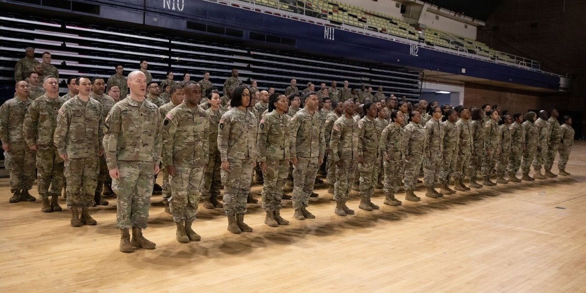 Rows of uniformed servicepeople in formation.