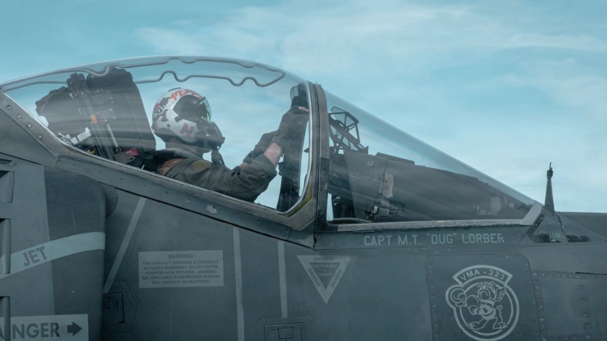 A U.S. Marine Corps AV-8B Harrier II pilot with Marine Medium Tiltrotor Squadron (VMM) 263 (Reinforced), 22nd Marine Expeditionary Unit (Special Operations Capable), prepares for flight operations aboard the Wasp-class amphibious assault ship USS Iwo Jima (LHD 7) while underway in the Caribbean Sea.