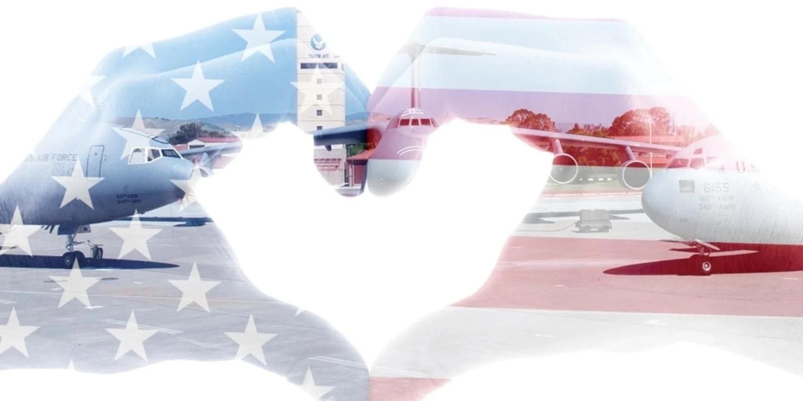 Heart hands with an American flag background.