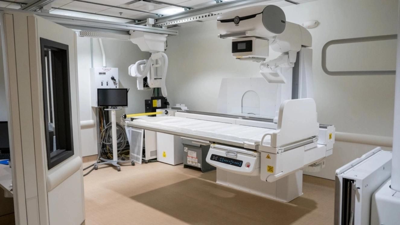 VA medical center radiology room with modern imaging equipment and monitor.