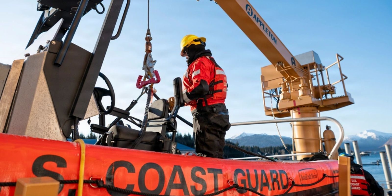 US Coast Guard member working on a boat.