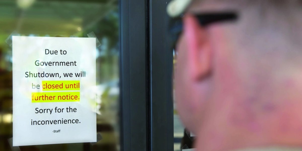 Service members are greeted by locked doors at the Harriotte B. Smith Library aboard Marine Corps Base Camp Lejeune due to a government shutdown.