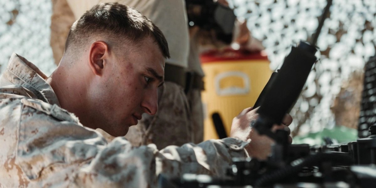U.S. Marine Corps Pfc. Gannon Williams, Oregon Native, infantryman with 3rd Battalion, 7th Marine Regiment, 1st Marine Division, puts together the new optic technology during a showcase at Range 215.