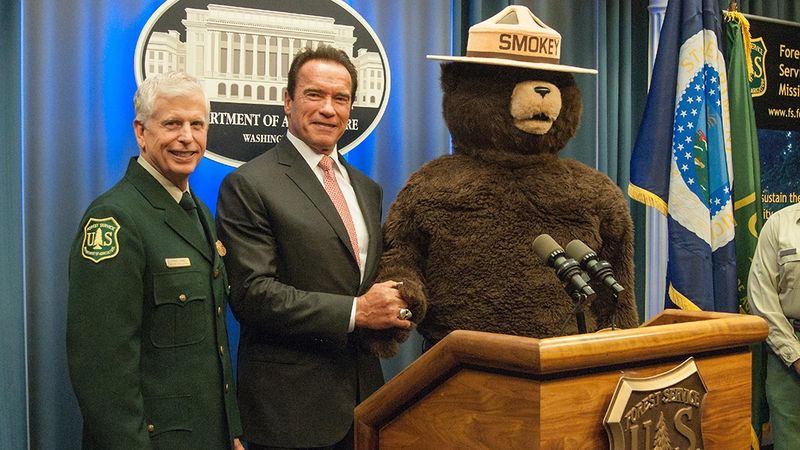 Smokey with Thomas Tidwell, Chief of the United States Forest Service, and Arnold Schwarzenegger.