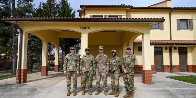 Leadership from the 39th Air Base Wing pose for a photo in front of base housing newly designated for accompanied dependents at Incirlik Air Base, Türkiye, March 18, 2025. 