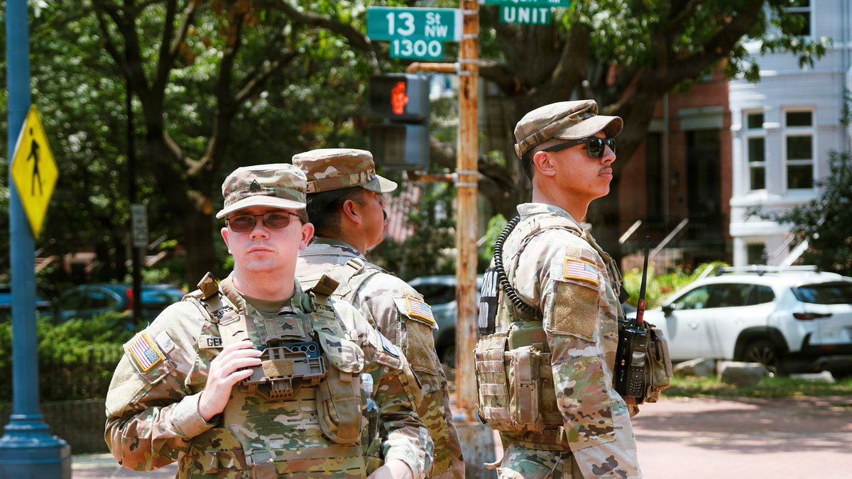 Three National Guard members on patrol closeup.