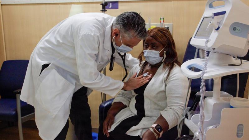 Dr. Pramvir S. Verma, Chief of the Hematology and Oncology department at the Alexander T. Augusta Military Medical Center (ATAMMC), conducts an exam during rounds March 19, 2026.