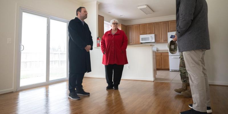 The U.S. Deputy Assistant Secretary of War for Housing, Adam Dontz, talks with members of the Liberty Park housing community at the Andrews housing office on Joint Base Andrews, Maryland, Dec. 8, 2025.