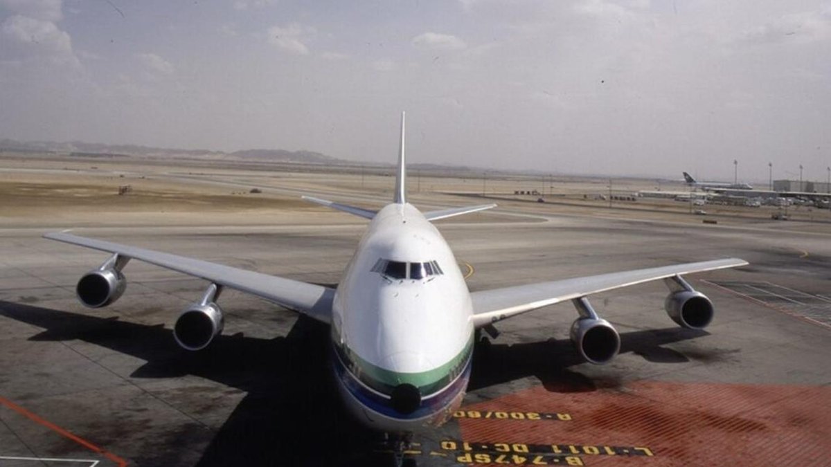 Boeing 747 aircraft parked on an airport tarmac in Washington under cloudy skies